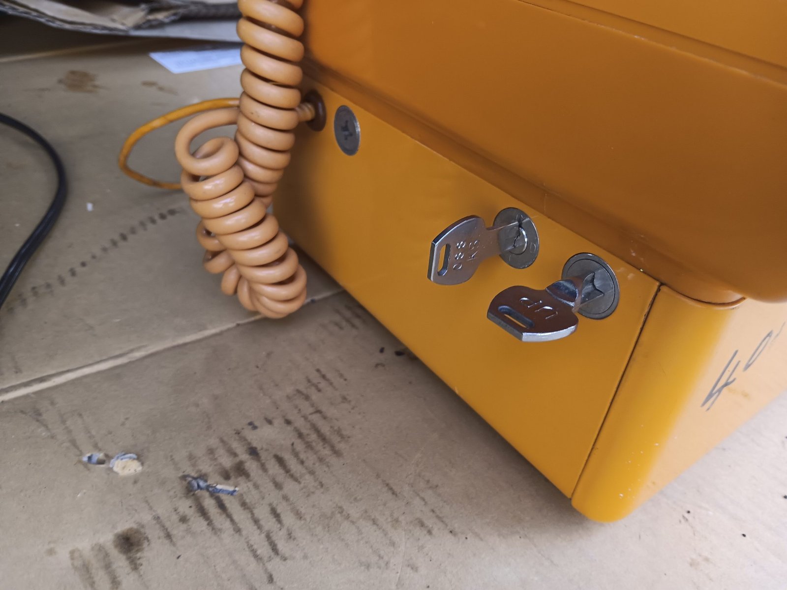 Gold Phone payphone - side view with keys (Lot 213)