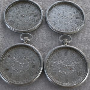 Set of four silver-tone pocket-watch style metal coasters with Roman numerals (Lot 220)