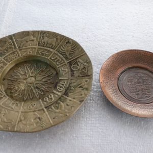 Pair of hanging plates – brass zodiac dish and smaller hammered copper dish (Lot 215)