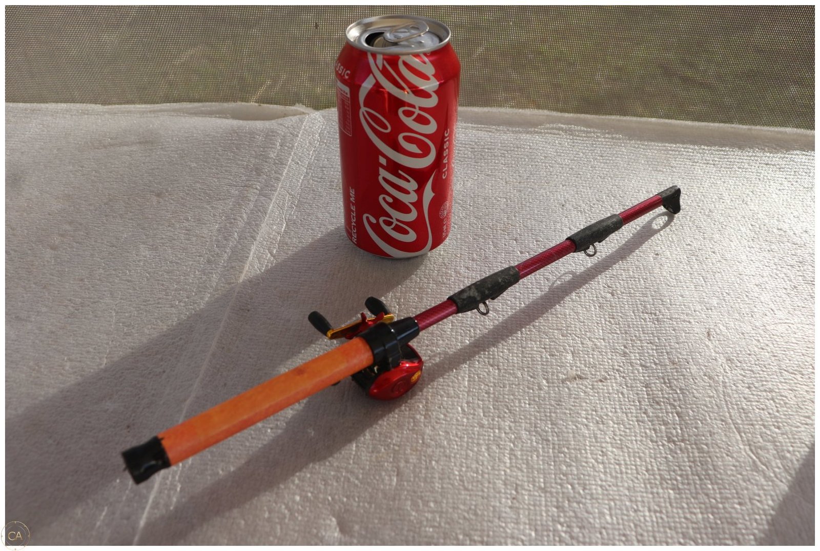 Lot 0270 - Novelty Fishing Rod Lighter with Reel (image 1)