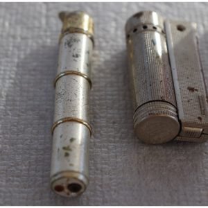 Lot 0259 - Pair of Vintage Metal Petrol Lighters (image 1)