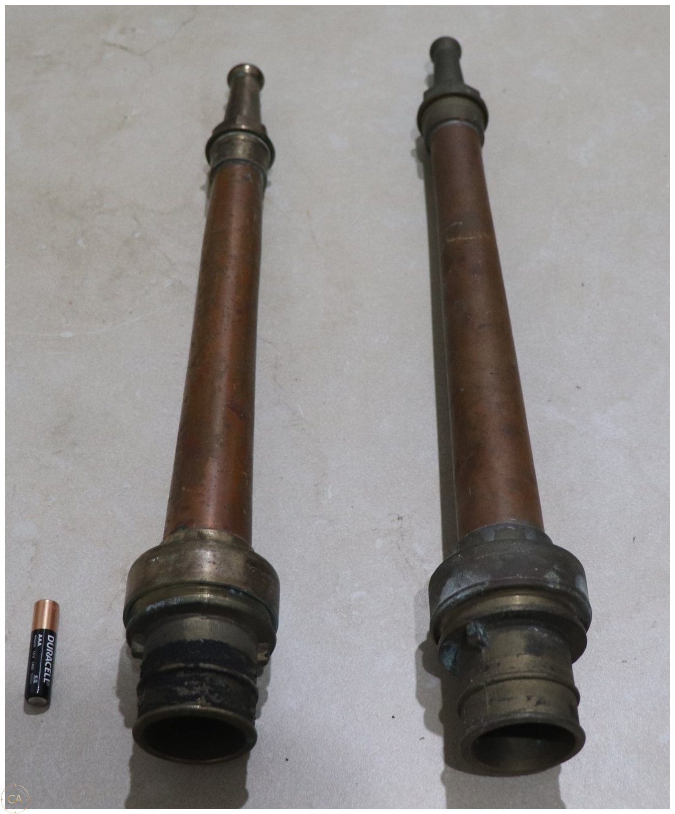 Lot 343 - Pair of Vintage Brass/Copper Fire Hose Nozzles (image 1)