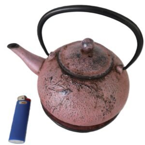 LOT 201 - Cast iron teapot & trivet with floral relief — pink speckle finish