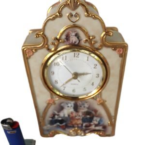 LOT 266 - Porcelain mantel clock – “Purr-fect Moments” cats, gilt trim