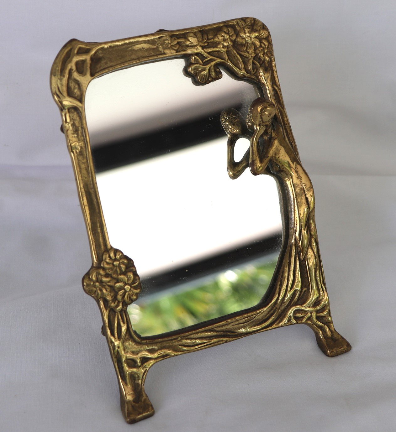 Art Nouveau style gilt table mirror with lady holding a hand mirror