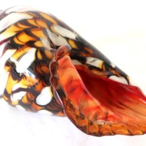 Art glass conch shell with red interior and amber white swirl exterior