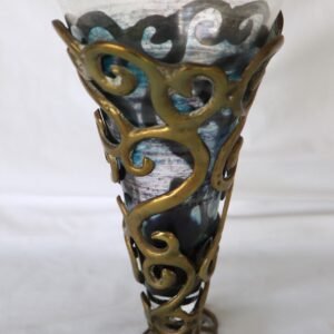 front view of brass and iridescent glass vase