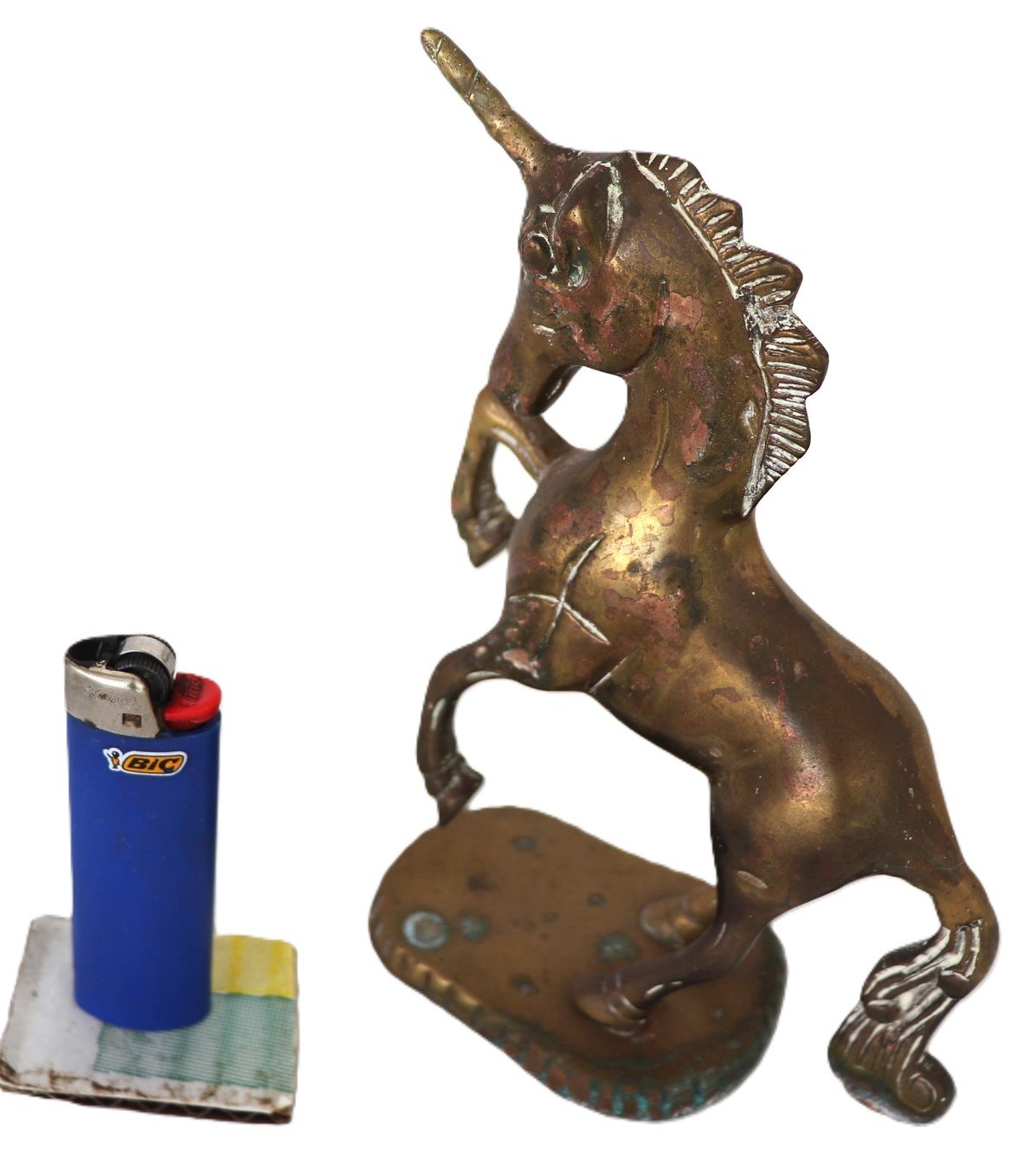 Side profile of brass unicorn ornament