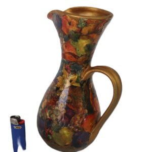 decorative floral jug with gold rim and handle