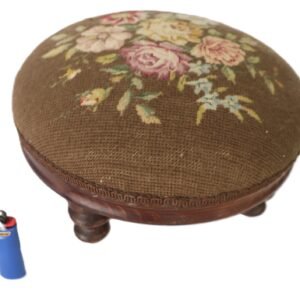 round needlepoint footstool with floral tapestry