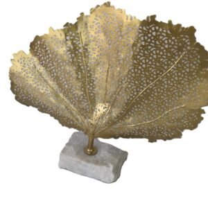 gold metal coral leaf sculpture on stone base