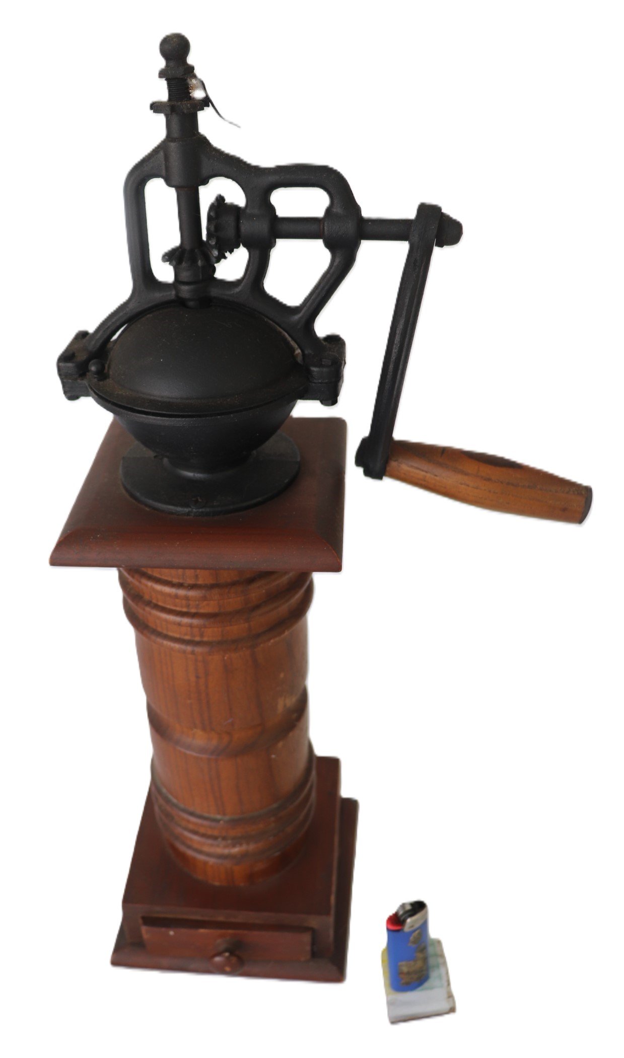Vintage hand-crank coffee grinder with wooden base and metal top