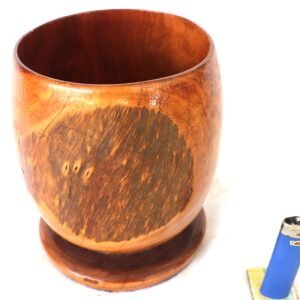 hand turned timber bowl on foot with lighter for scale