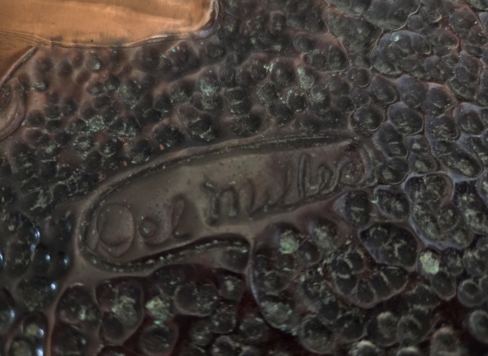 Embossed copper woman portrait with green jewel