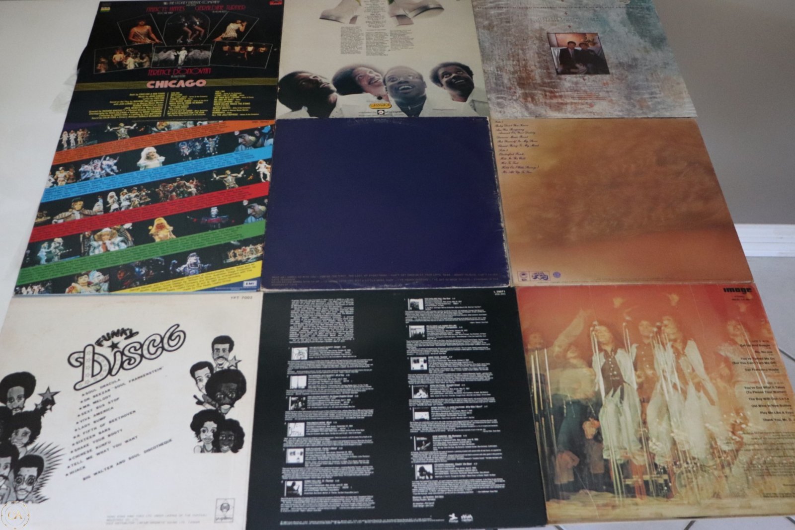 Back covers of the same 9 LPs showing track listings and artwork
