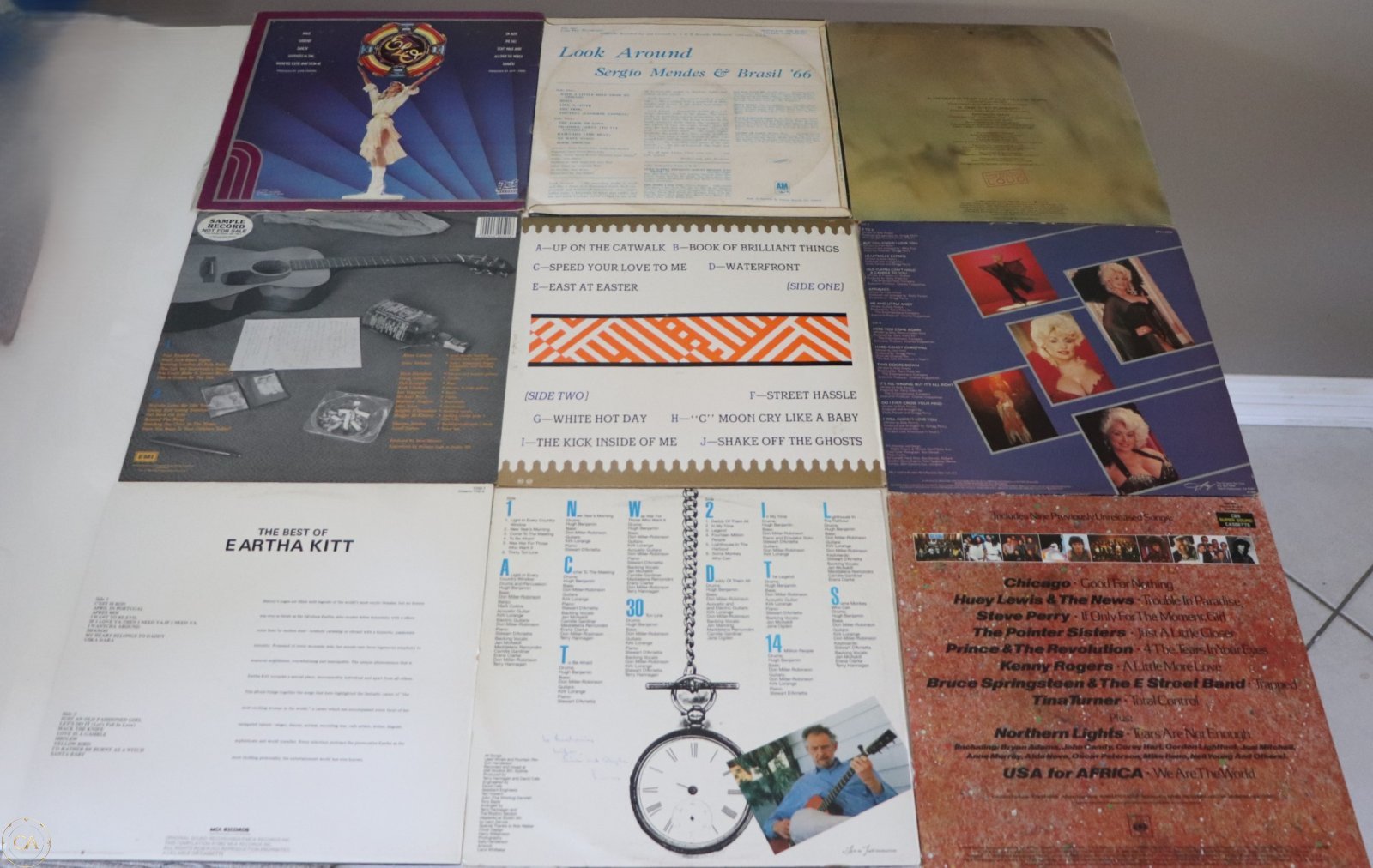 Back covers of the same 9 LPs showing track listings