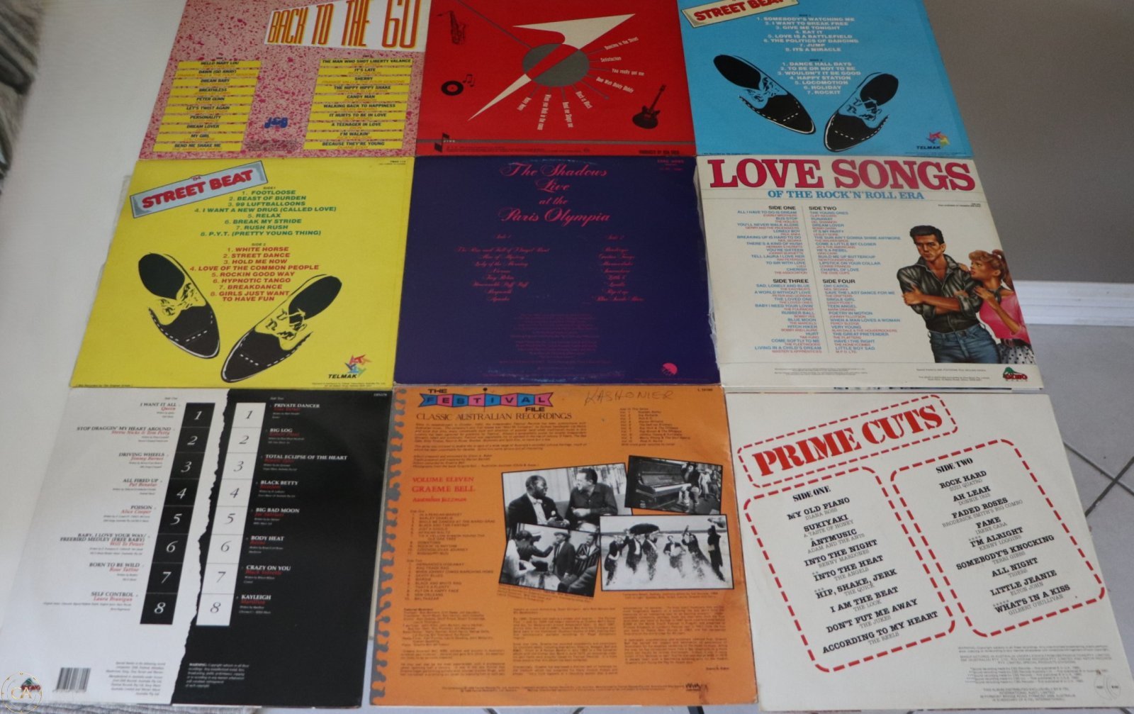 Back covers of the same 9 LPs showing track listings