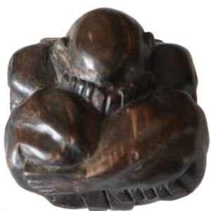 hand carved wooden figure curled form