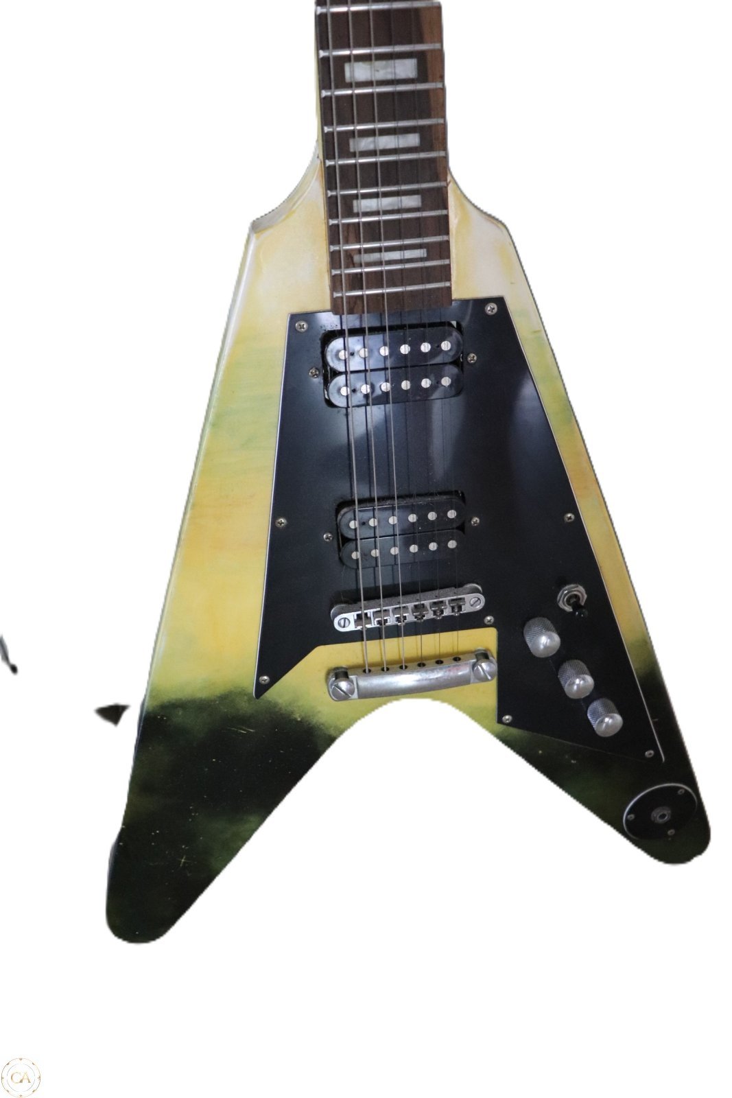 Flying V guitar body close-up with twin humbuckers
