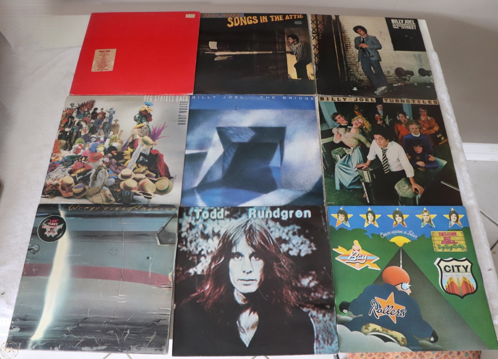 Front covers of nine classic rock LPs including Billy Joel and Elton John