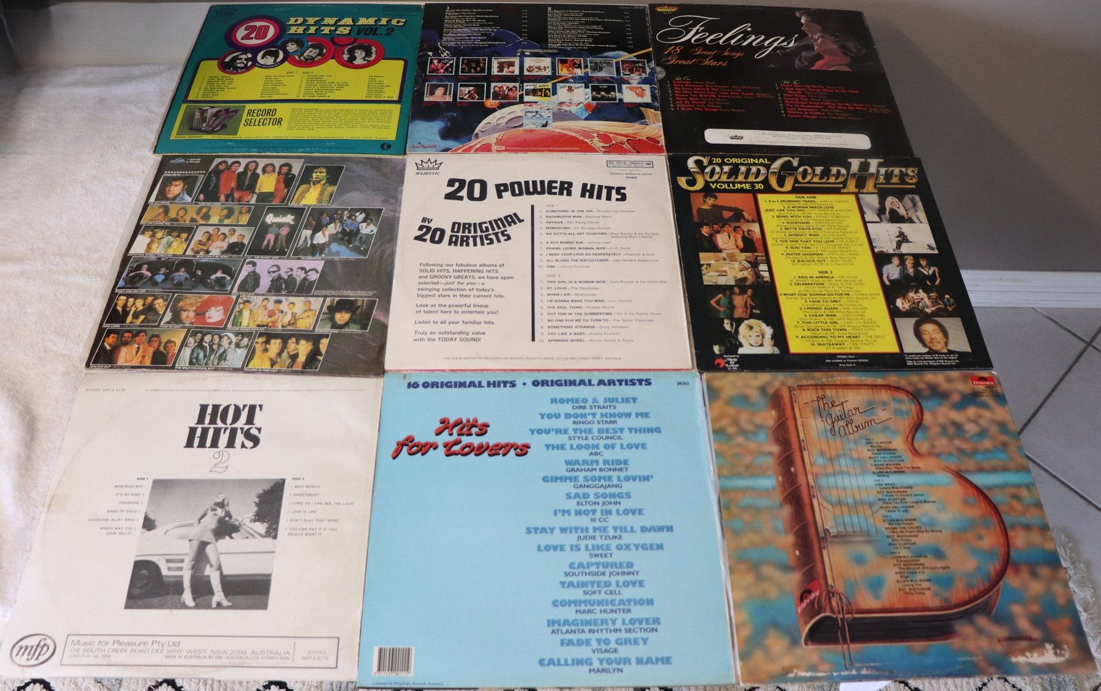 Back covers of 9 vintage compilation vinyl albums showing song lists