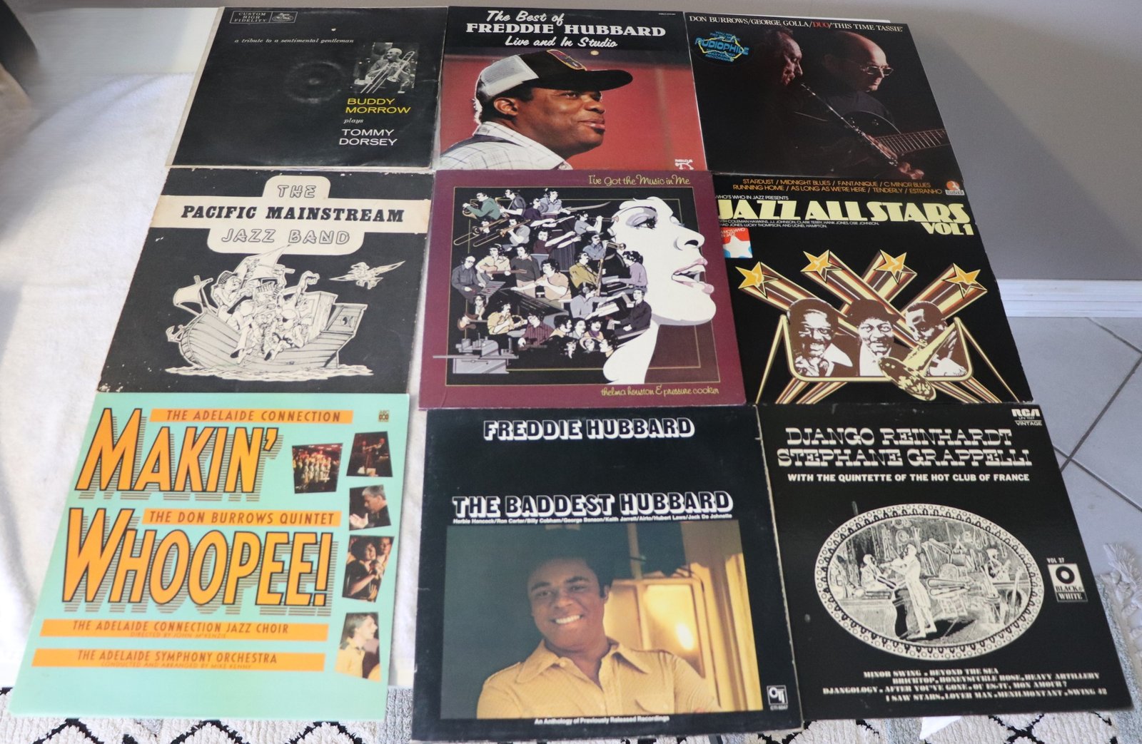 Front covers of nine classic jazz vinyl records including Freddie Hubbard and Django Reinhardt