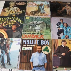 Front covers of nine country and outback themed vinyl albums featuring John Williamson, Slim Dusty, and Johnny Cash