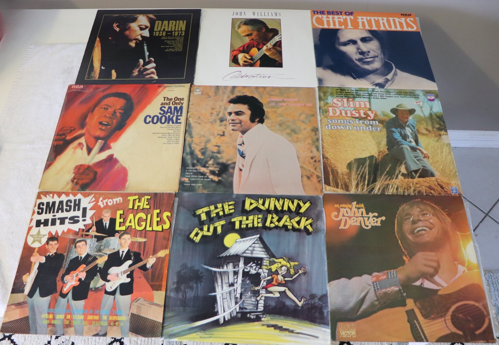 Front covers of nine classic vinyl albums including Chet Atkins, Sam Cooke, and John Denver