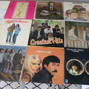 Front covers of nine classic pop and soft rock vinyl albums including Cilla Black, The Everly Brothers, and Loggins & Messina