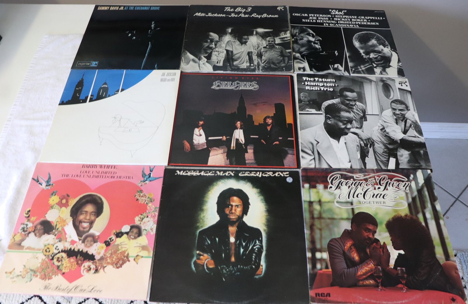 Front covers of nine soul and jazz vinyl albums including Sammy Davis Jr, Barry White, and Oscar Peterson
