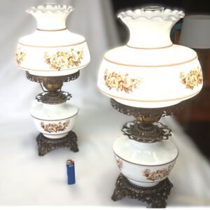 Vintage milk glass oil lamp with floral shade and cast metal base