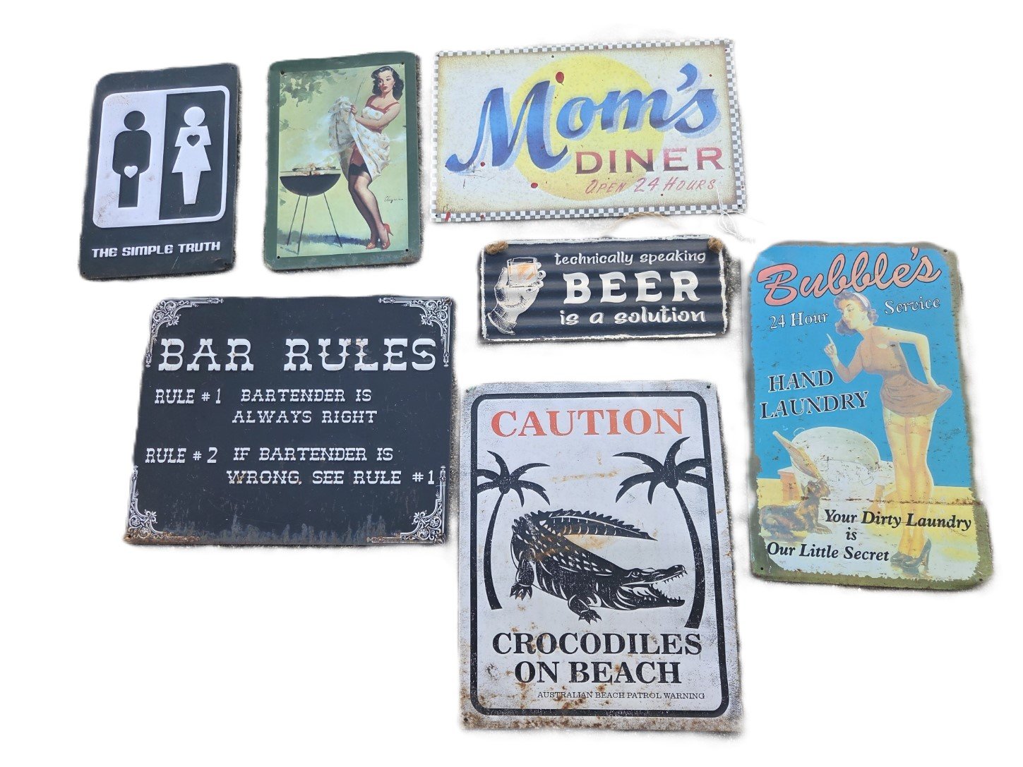 Assorted vintage style metal wall signs including bar rules crocodile warning and retro pin up designs
