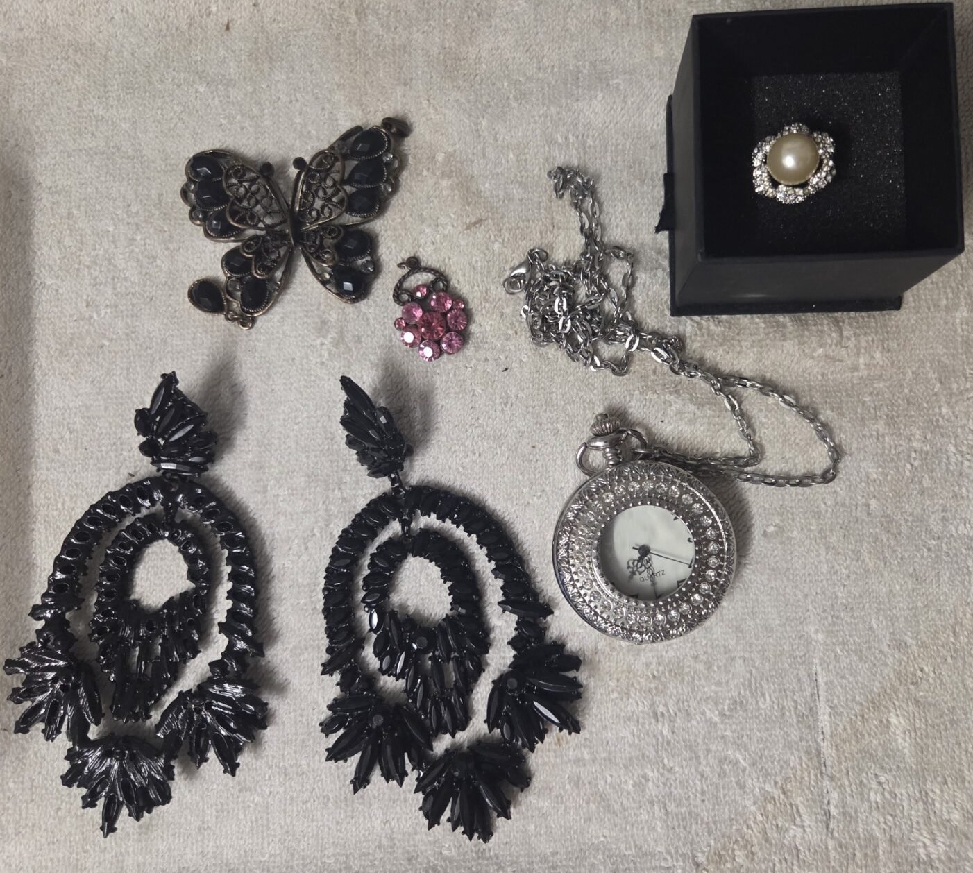 Butterfly brooch with dark stones