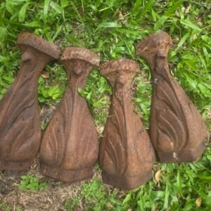 Set of four vintage cast iron oven feet with heavy rust patina