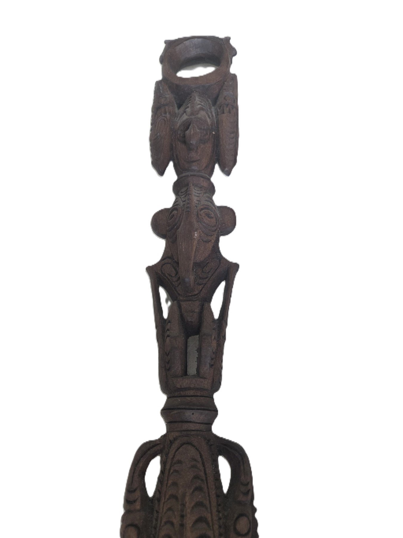 Totem style carved figures walking stick detail