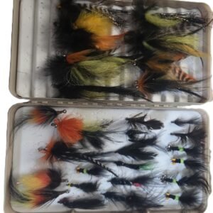 Assorted handmade fishing flies in storage case