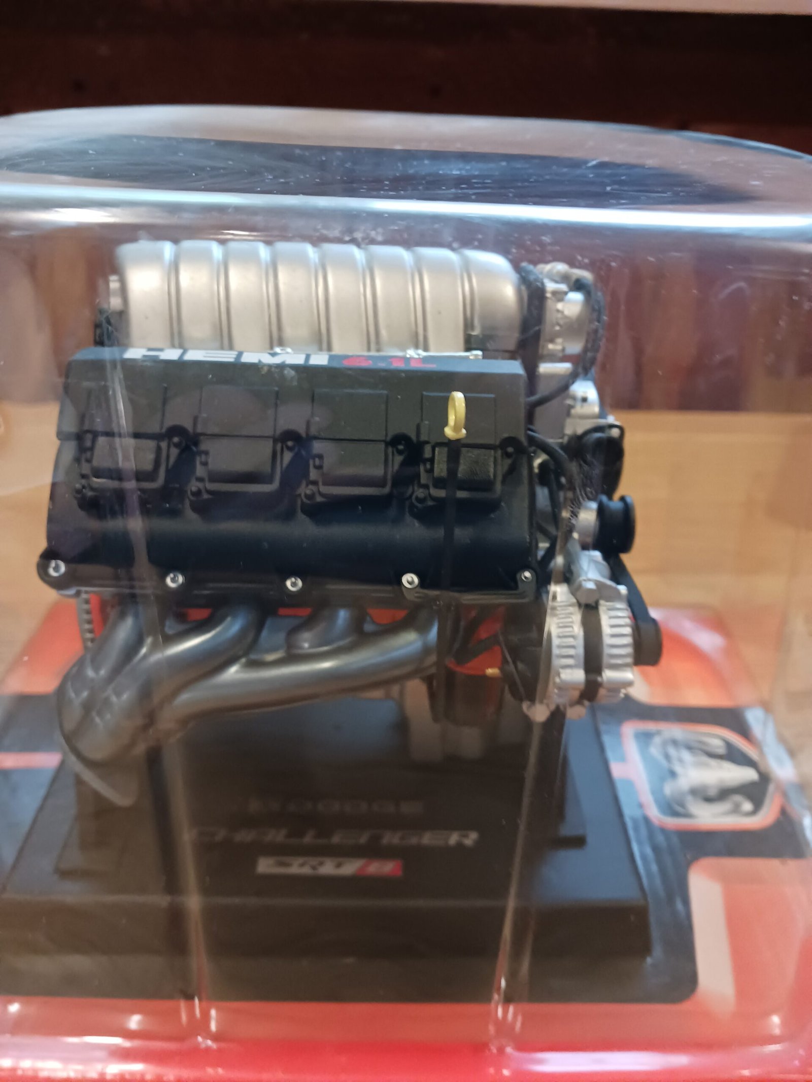 Detailed side view showing exhaust headers and engine components