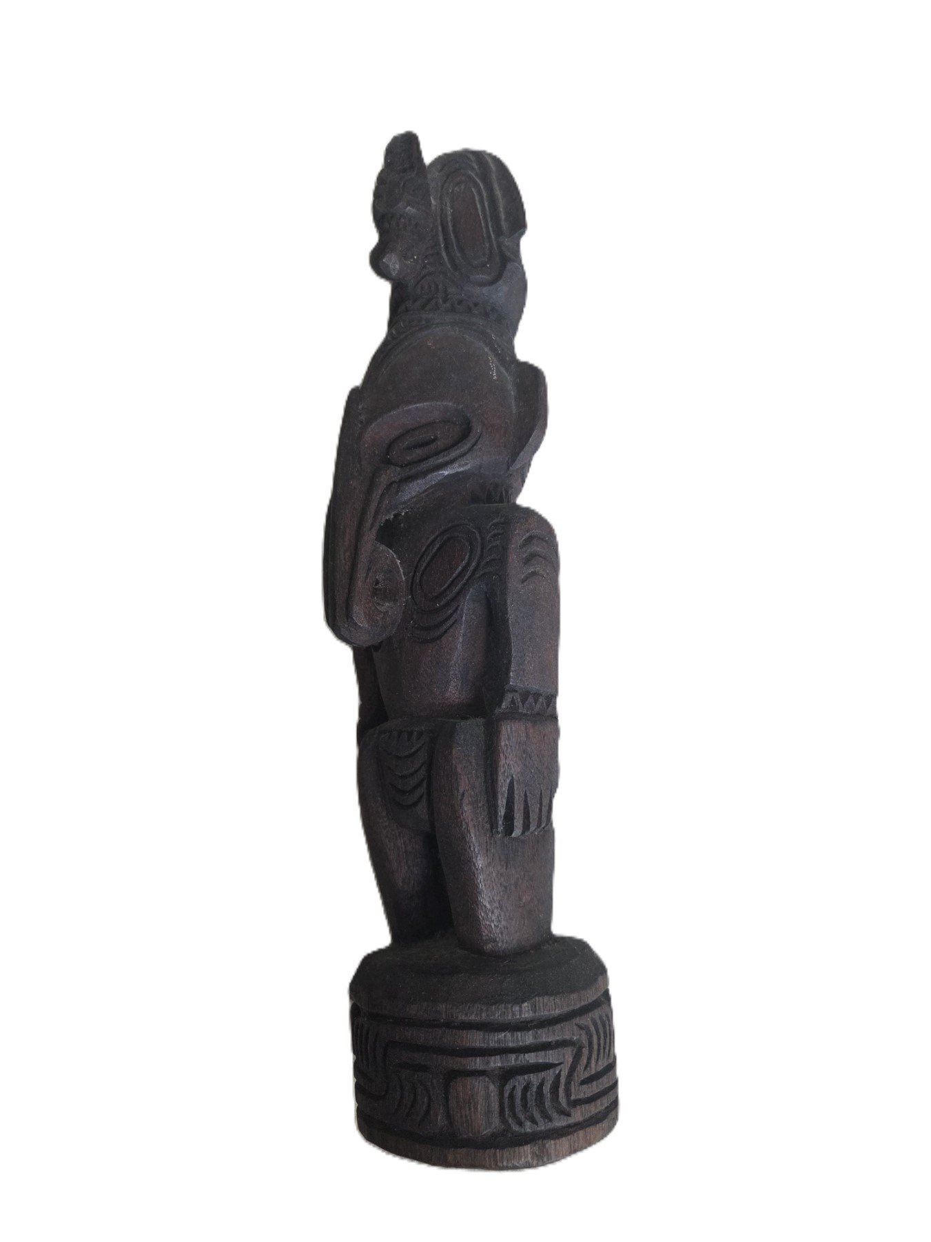 Hand carved tribal figure with hook nose