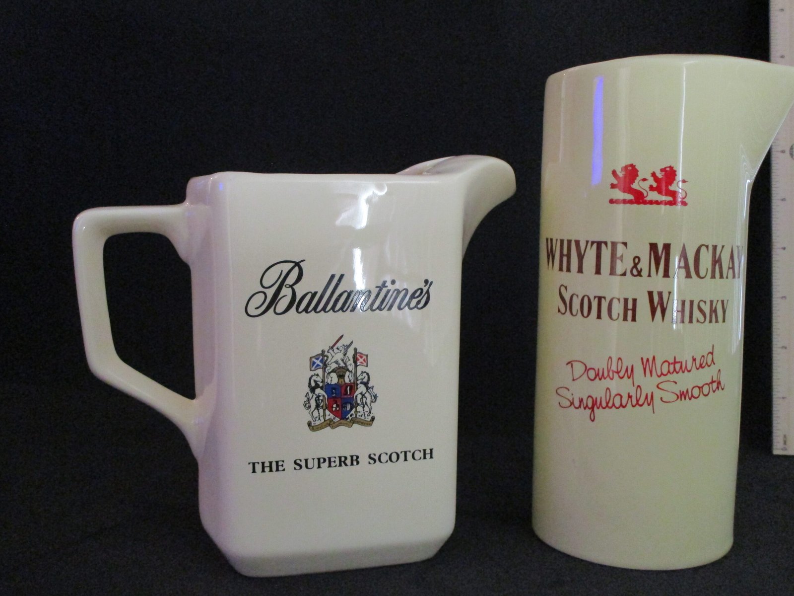 Pair of vintage whisky advertising ceramic jugs