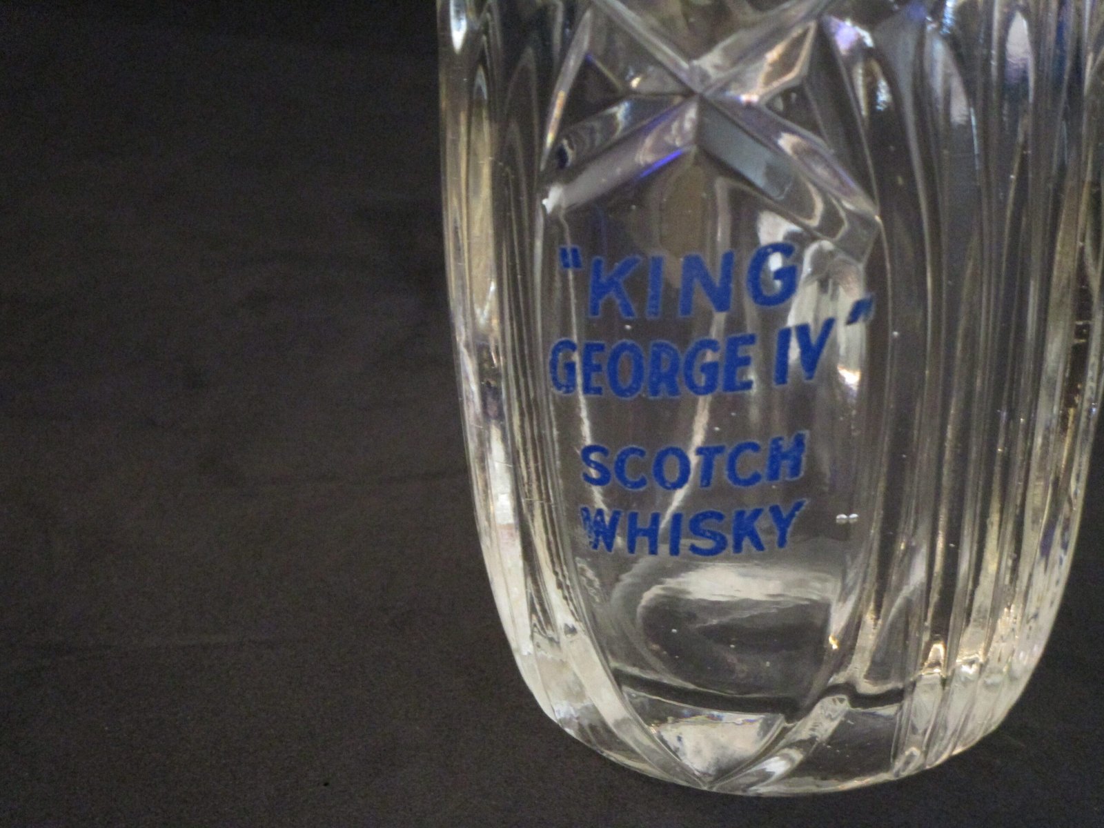 Vintage pressed glass whisky water jug with blue branding
