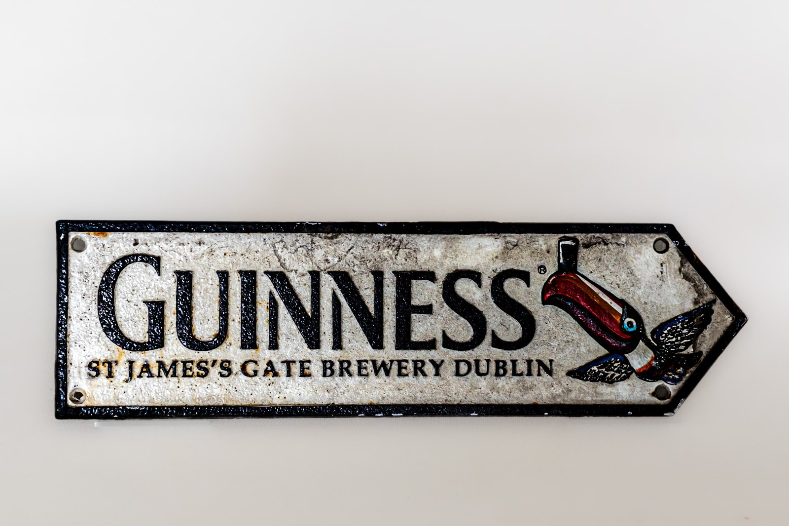 LOT038 Guinness St James's Gate Brewery Dublin cast iron wall sign with toucan