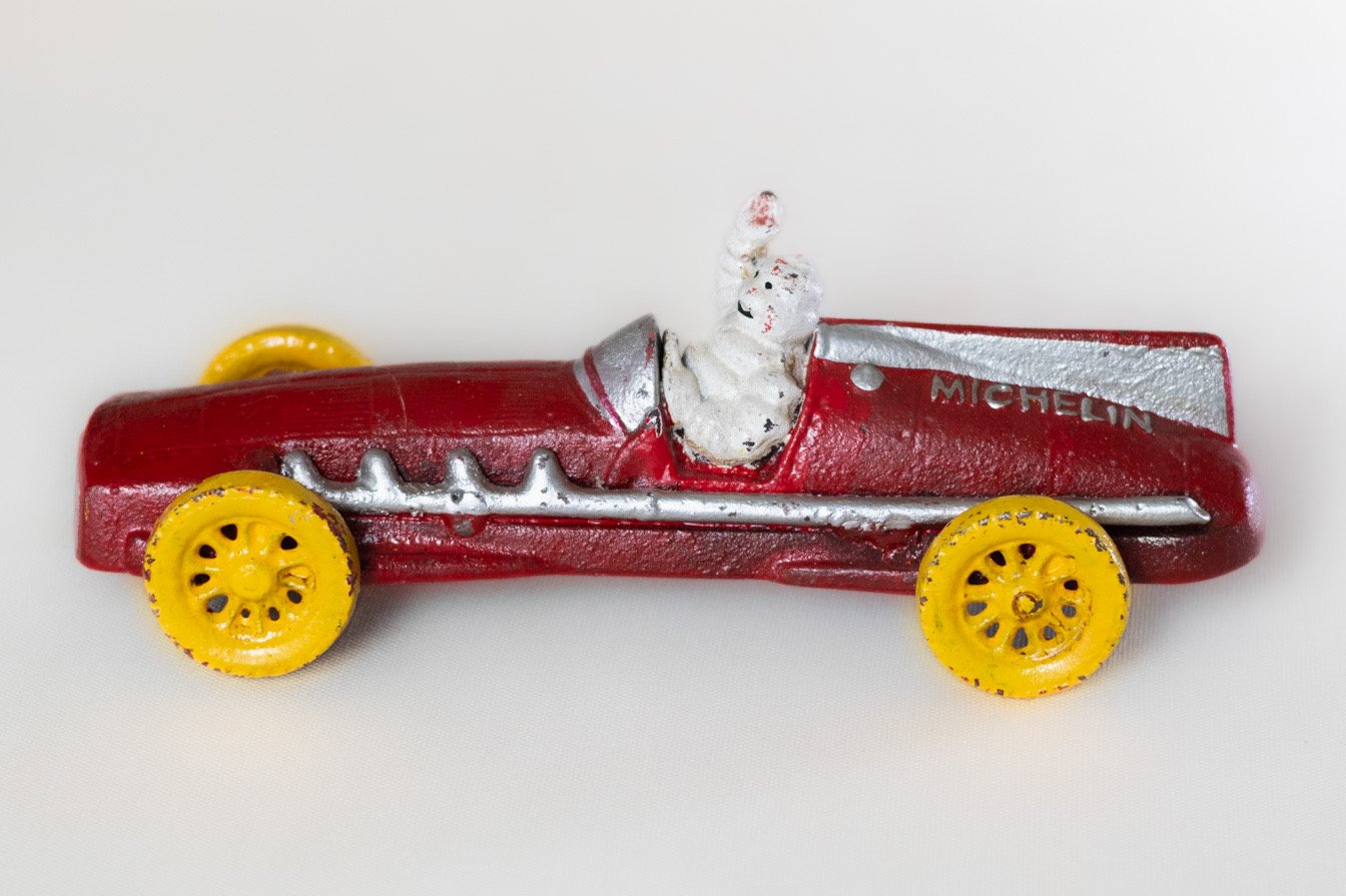 LOT016 side profile of Michelin Bibendum cast iron racing car