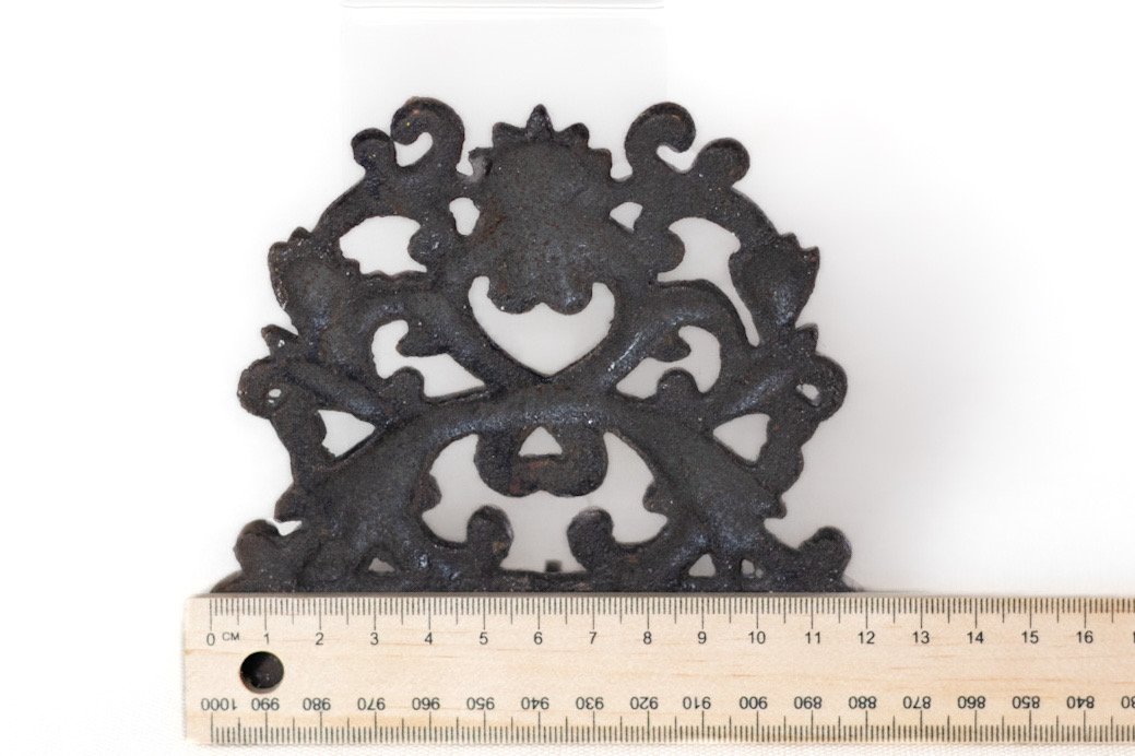 LOT011 cast iron ornate key rack with ruler for size reference